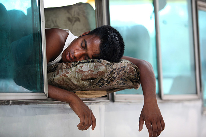 24 hours: Dhaka, Bangladesh: A man sleeps during day two of the country-wide strike