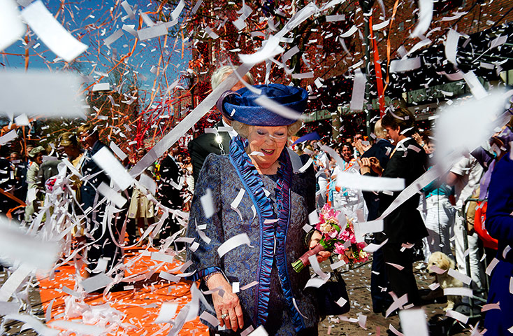 Picture desk live: scenes of celebration greet Queen Beatrix in the Netherlands
