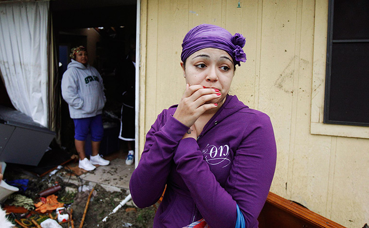 Texas tornado: A resident looks on at the damage caused by a tornado in Lancaster