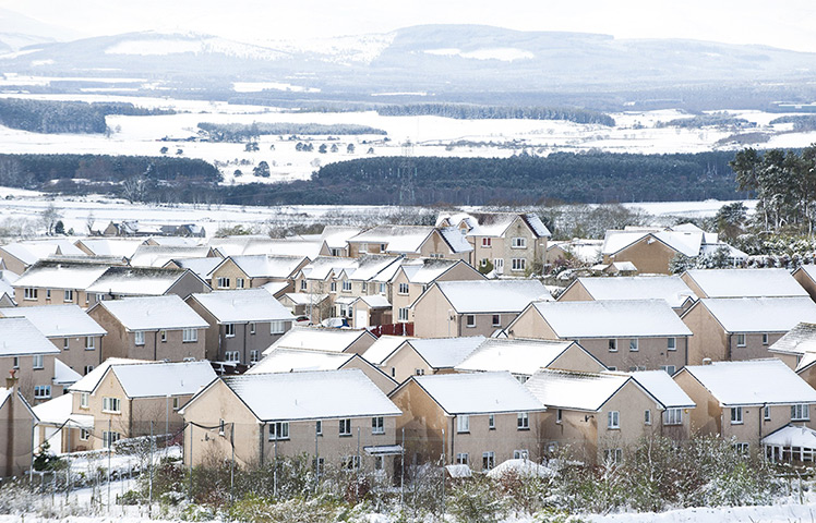 UK snow: Snow covers the roofs of houses in Westhill in Aberdeenshire