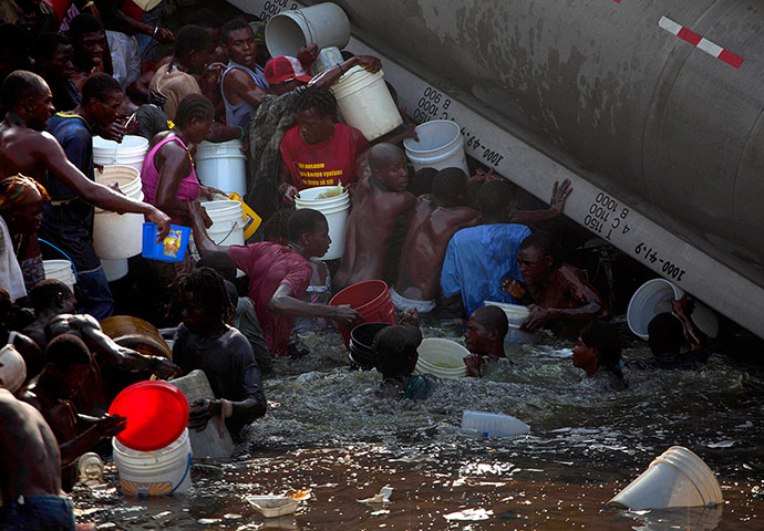 Haiti: People collect fuel in Haiti