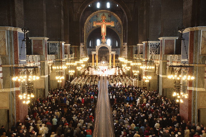 24 Hours: London, UK: Priests file out of Westminster Cathedral after Chrism Mass