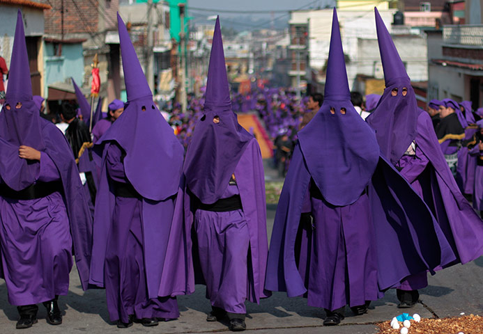 Holy Week: Men dressed for the procession of the statue of Jesus
