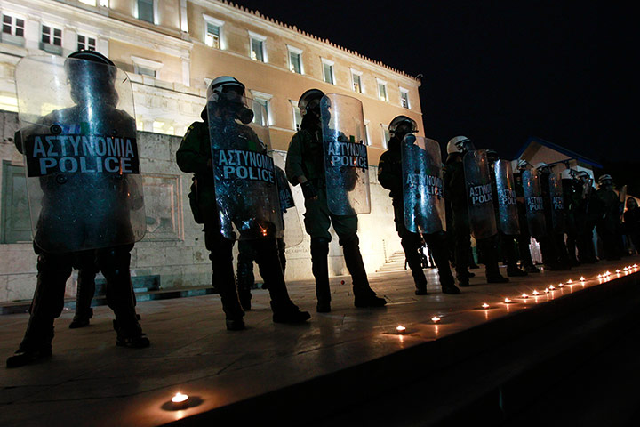 Greece unrest: Candles commemorating the death of a pensioner
