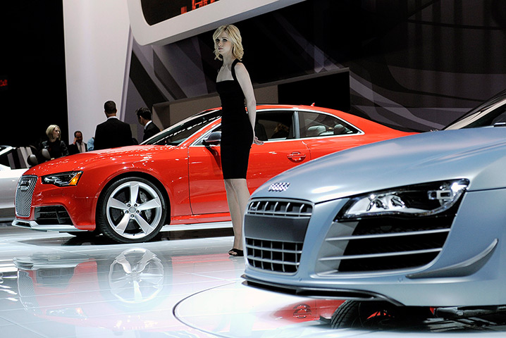 New York auto show: A model stands between cars in the Audi display area