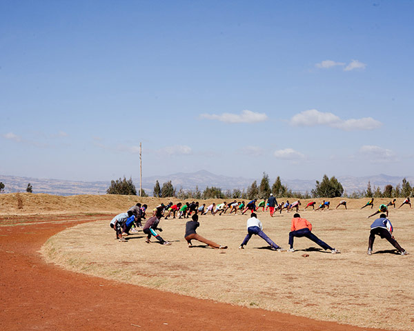 Ethiopia Runners: Runners stretching on the track in Bekoji, Ethiopia