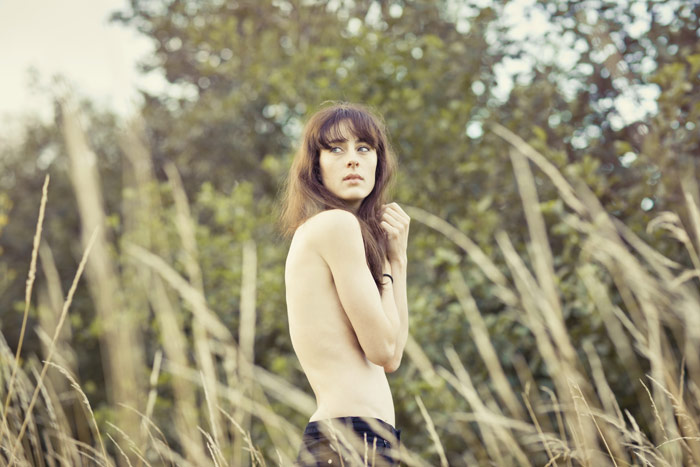 Getty gallery: Topless woman in meadow