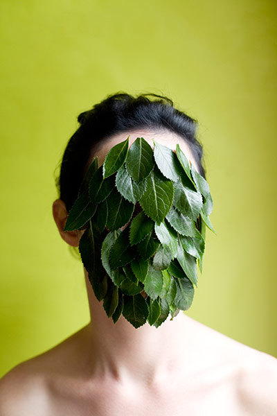 Getty gallery: Woman's face covered with leaves