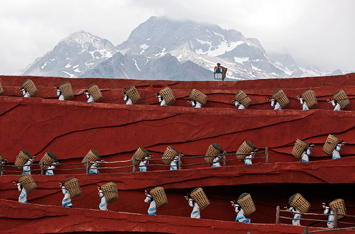 FTA: How Hwee Young: Members of the Naxi, Yi and Bai ethnic minorities perform a cultural show