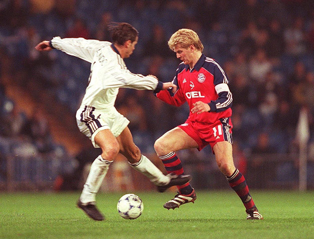 Real v Bayern: Bayern Munich's Stefen Effenberg takes the ball past Real Madrid's Redondo 