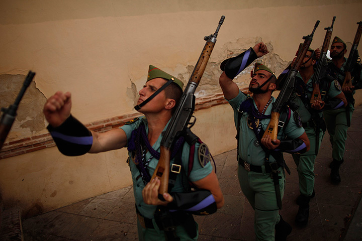 24 hours in pictures: Spanish legionnaires march to a chapel during Holy Week in Malaga