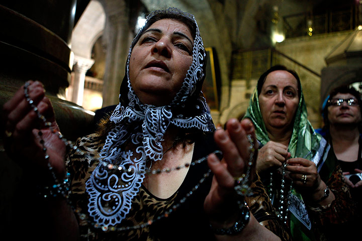 Easter:  Catholic pilgrims pray during the Holy Thursday mass 