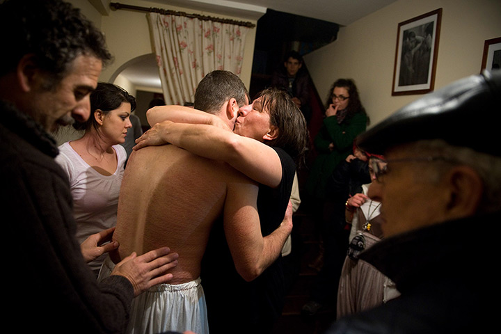 24 hours: Valverde De La Vera, Spain: A man is comforted after he was tied to cross