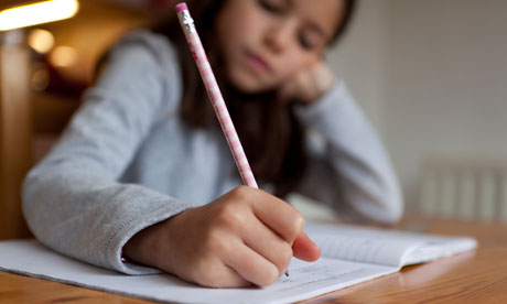 A young girl writing