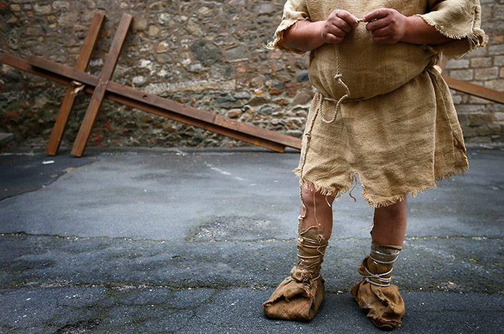 Good Friday traditions: Bensheim, Germany: A man waits to take part in a re-enactment