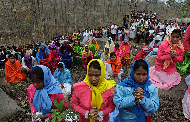 Good Friday traditions: Gauhati, India: Devotees offer prayers during a re-enactment of crucifixion
