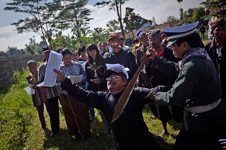 Good Friday traditions: Klaten, Indonesia: Catholics participate in re-enactment the crucifixion