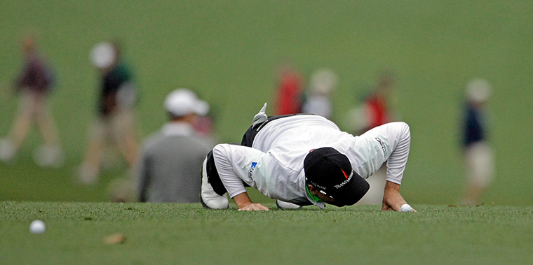 Augusta day 2: Zach Johnson checks for his ball on the first fairway 