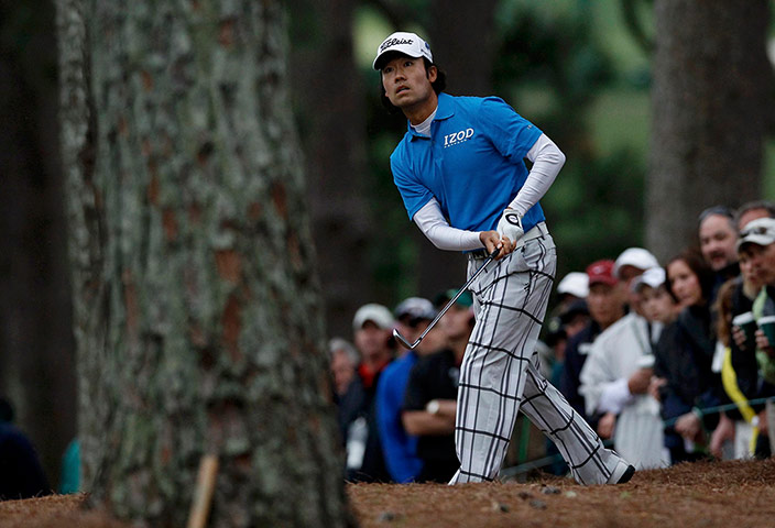 Augusta day 2: Kevin Na looks worried as he watches his approach shot to the first green 