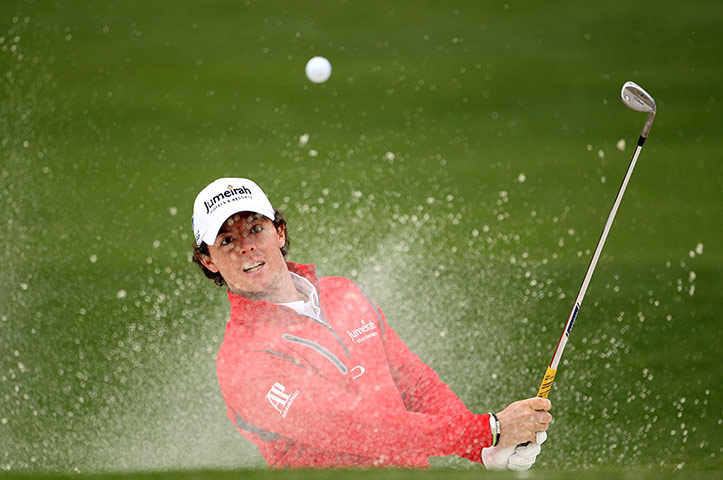 Augusta day 2: Rory McIlroy hits a shot from a greenside bunker on the second hole 