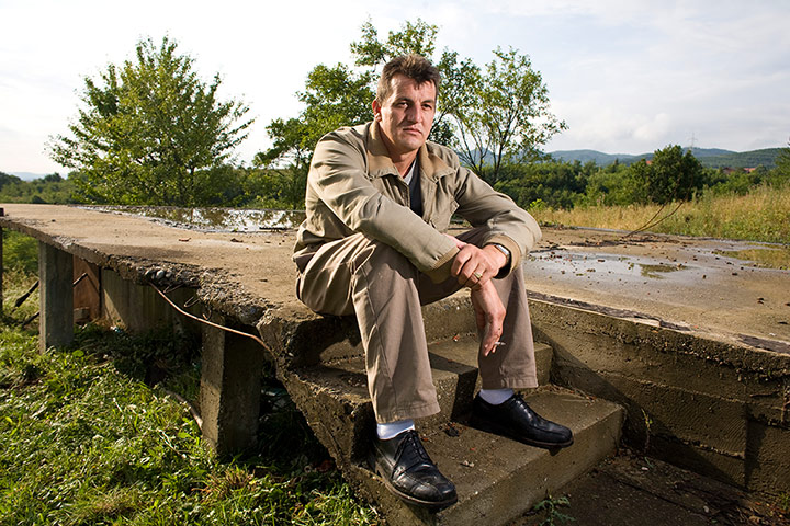 Bosnia: Fikret Alic at the ruins of his relatives house