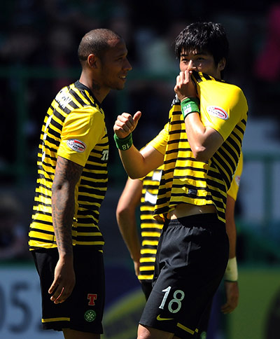 Celtic's season: Sung Yueng Ki of Celtic kisses the badge on his shirt 