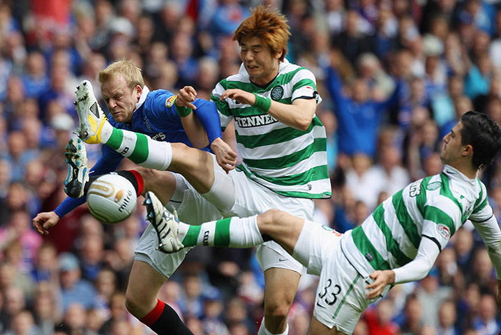 Celtic's season: Steven Naismith of Rangers tackles Ki Sung- Yueng and Beram Kayal of Celtic