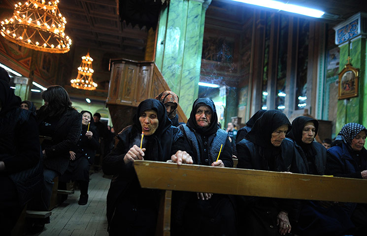 24 hours: Catholic women attend an Easter vigil mass in Rakovski