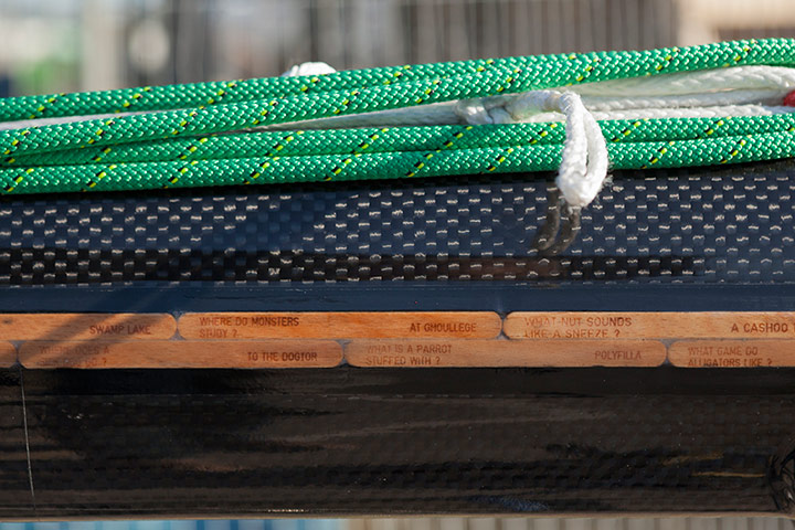 The Boat Project: A collection of lollypop stick jokes adorn the top of the mast