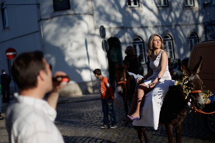 24 hours in pictures: A woman takes part in the procession of the 