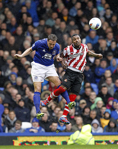 Premier League round-up: Stephane Sessegnon and Phil Jagielka have an aerial battle. 