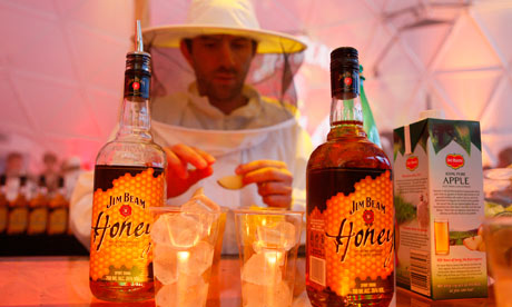 A bartender dressed as a beekeeper at the Jim Beam Honey launch party