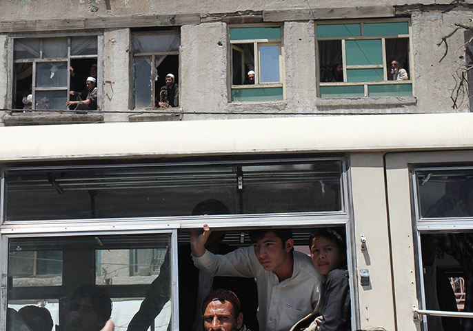 24 hours in pictures: Afghans watch protestors marching in Kabul