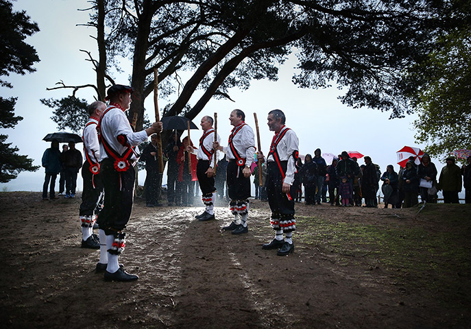 24 hours in pictures: Pilgrim Morris Men dance on St Martha's Hill at dawn