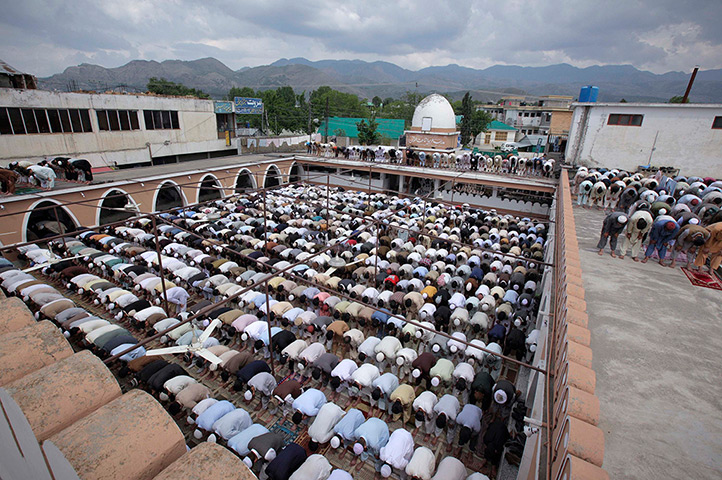 Abbottabad one year on: Residents offer Friday prayers in an open yard of the Jamia Masjid Mandian