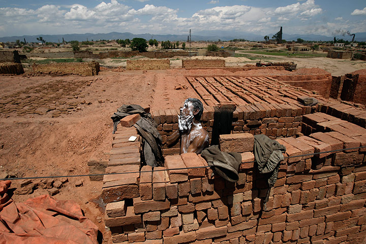 Picture Desk Live: A Pakistani man who works in a brick factory