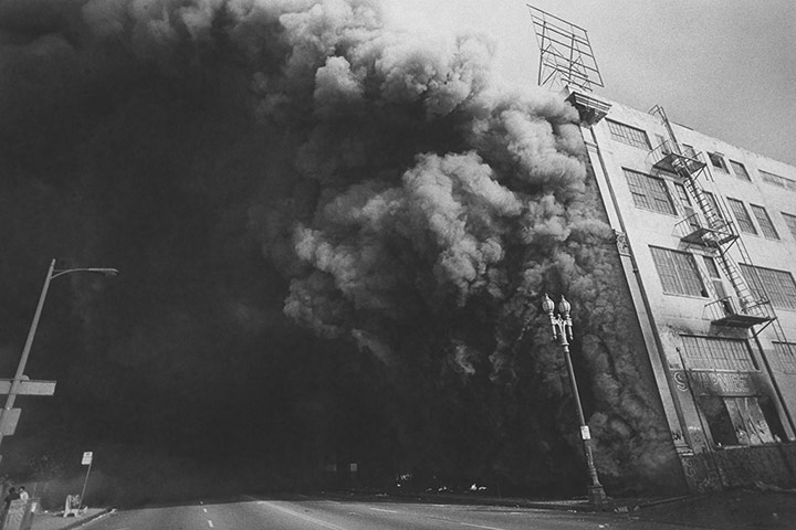 Rodney King riots: A burning building at Union and 7th Street, 1992