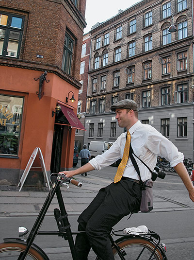Big Picture, bikes: Big Picture: man cycling wearing a flat cap