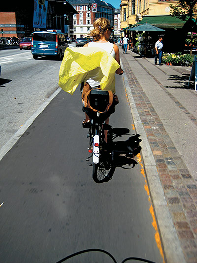 Big Picture, bikes: Big Picture: girl on a bike with her dress blowing in the wind