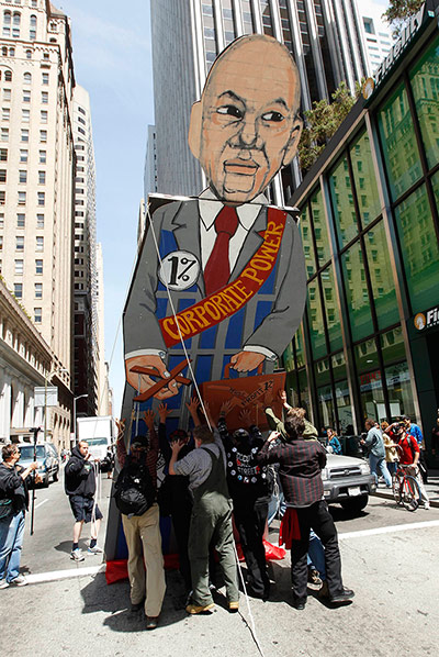Occupy May Day: A large cut-out representing corporate power in San Francisco