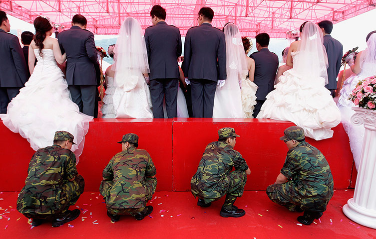 Picture Desk Live: Soldiers guard a stand during a wedding