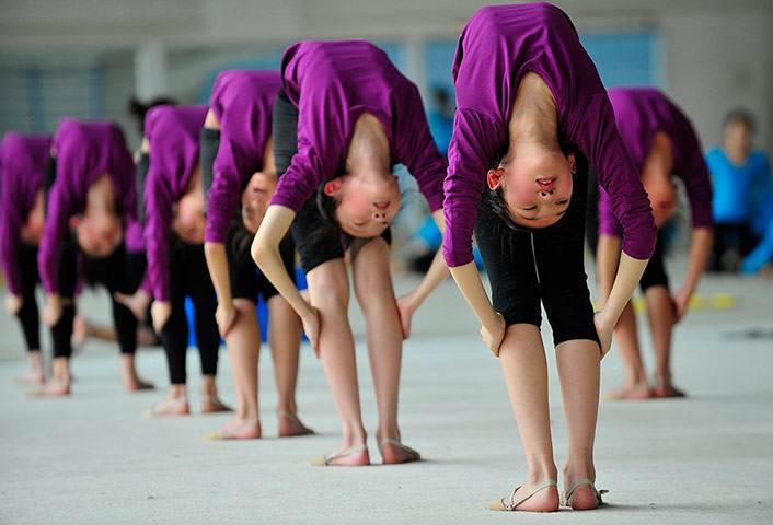 Picture Desk Live: Students stretch during a training session at a gym