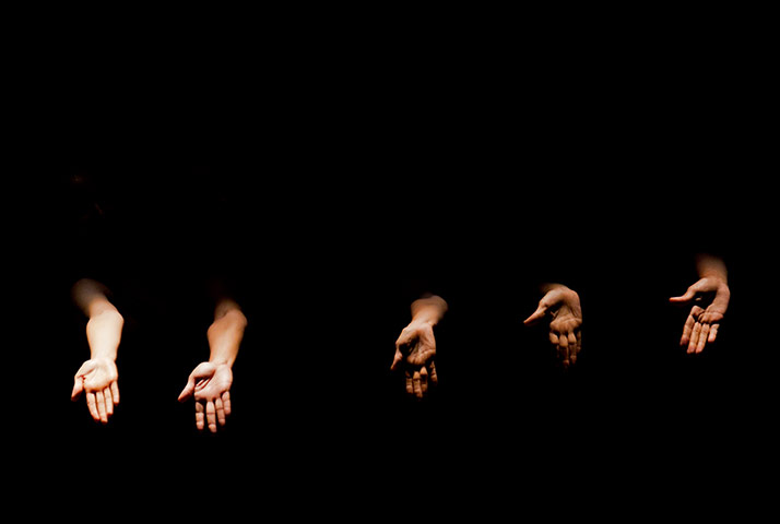 24 hours: Dancer's hands are illuminate during a performance by the National Ballet