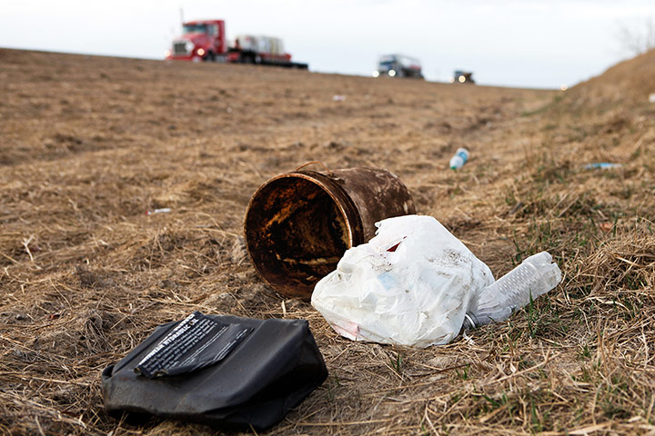 Oil in North Dakota: trash in a gully alongside Highway 85 near Williston