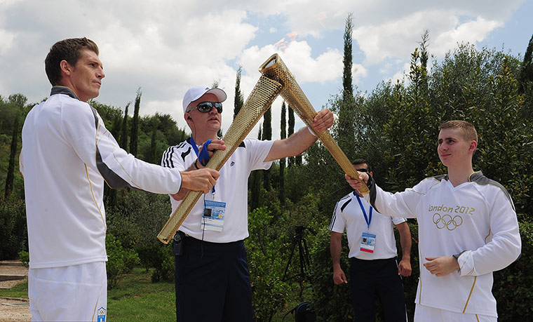 Olympic Torch: Alex Loukas from Britain lights the London 2012 Olympic Torch