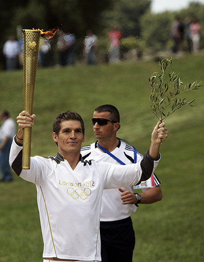Olympic Torch: Spyros Gianniotis of Greece holds the London 2012 Olympic Torch 