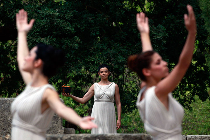 Olympic Torch: 'High priestess' Ino Menegaki carries a cauldron with the Olympic flame