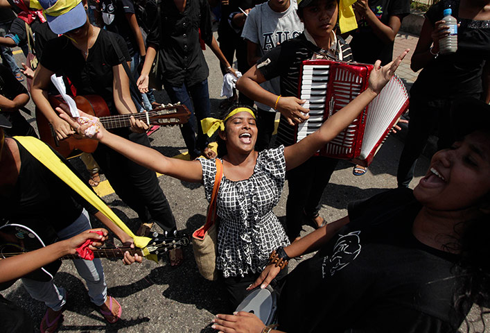 Picture Desk Live: A protestor sings in Sri Lanka