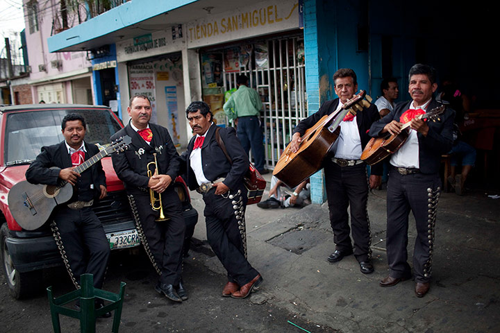 24 hours: Mariachi musicians wait to perform for a client on Mother's Day