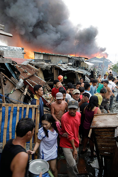 Manila: A blaze at a shanty town in Manila's seaport area.